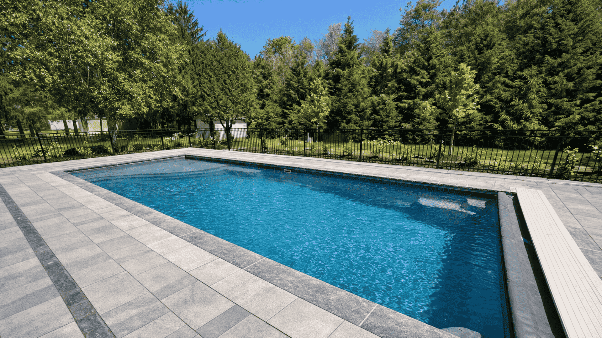 Beautiful fiberglass pool in a backyard