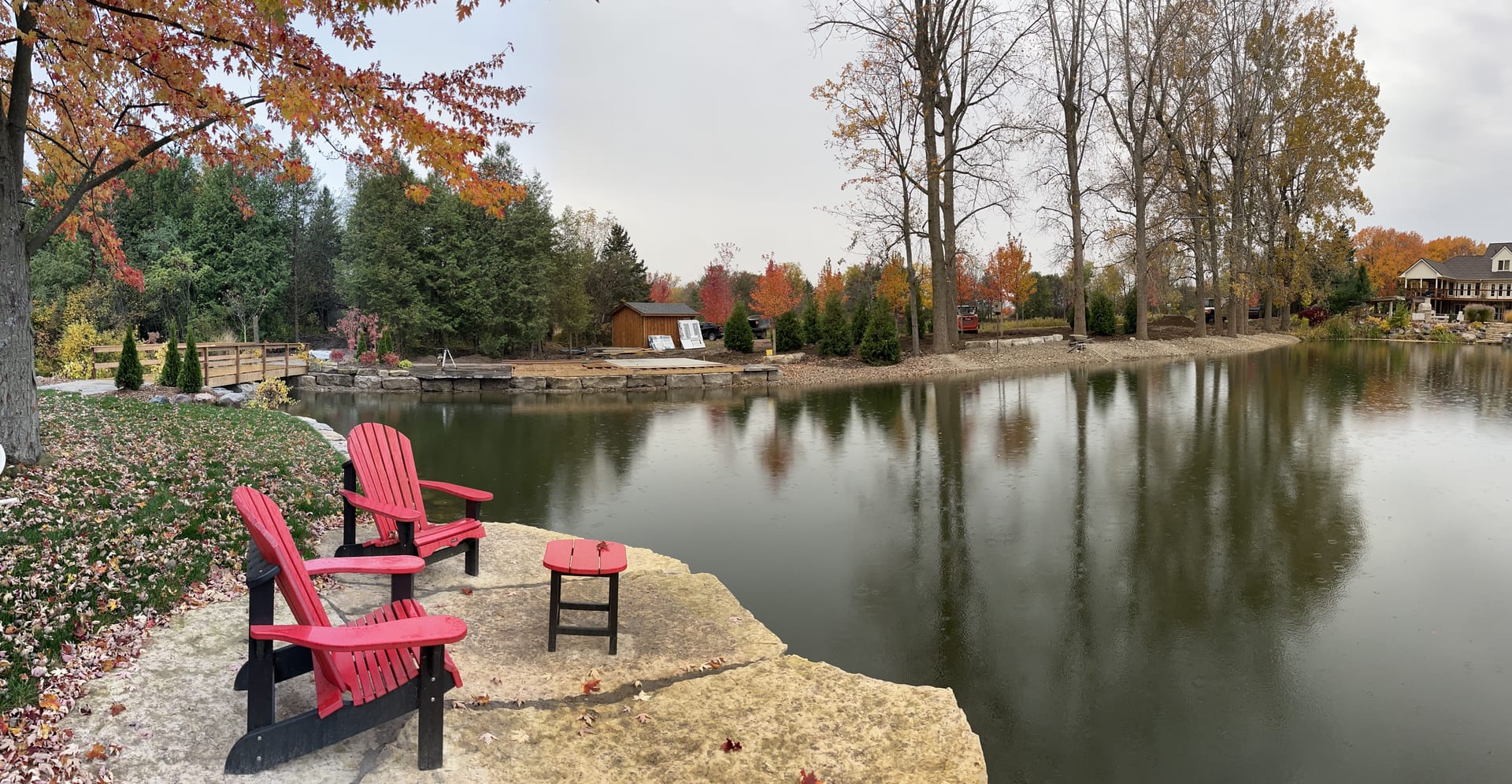 Well-maintained pond with natural stone edging